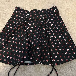 Black mushroom skirt with ties in front